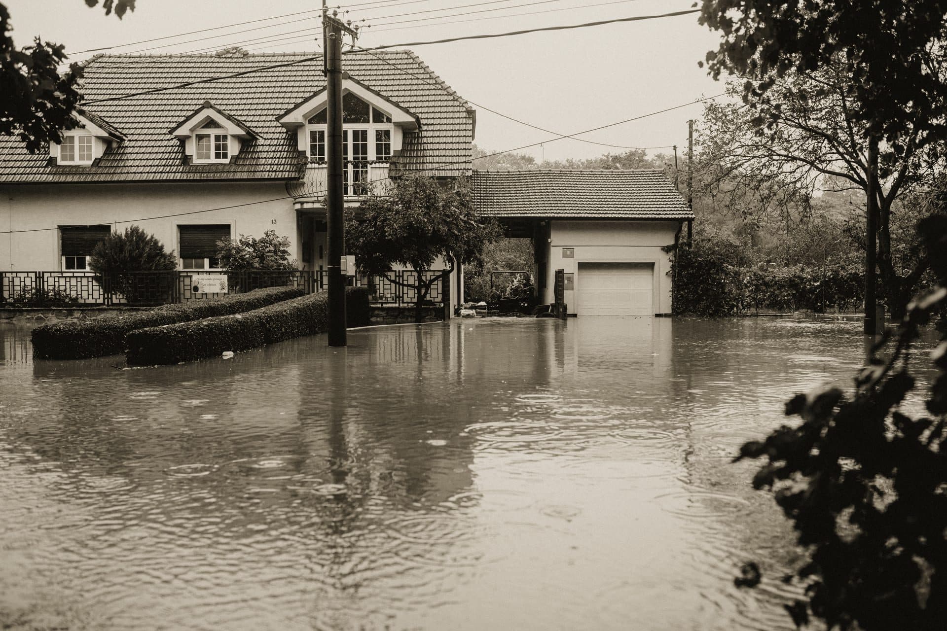 Floodwater surrounding a suburban house after heavy rain