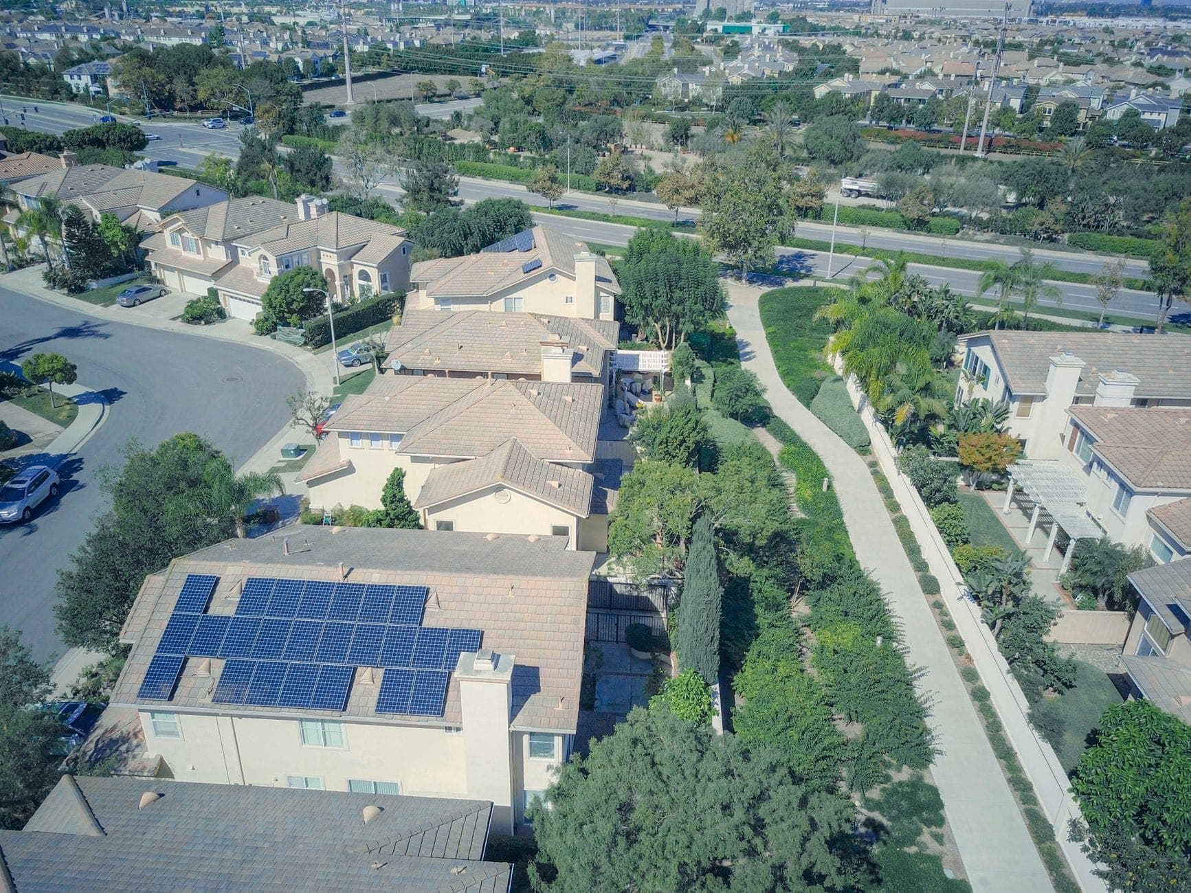 An aerial view of a Southern California residential neighborhood of tile-roof homes