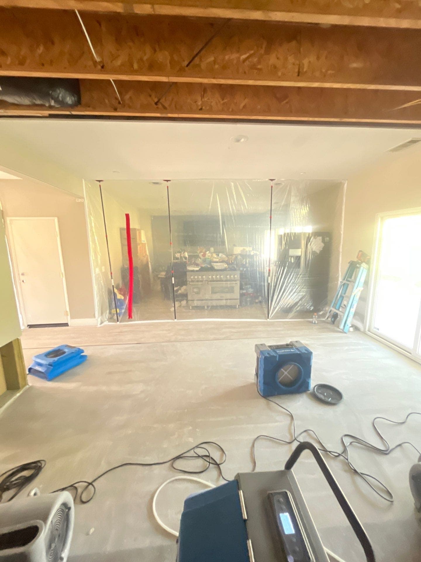 Containment sheeting and equipment set up to isolate and treat a smoke-affected room
