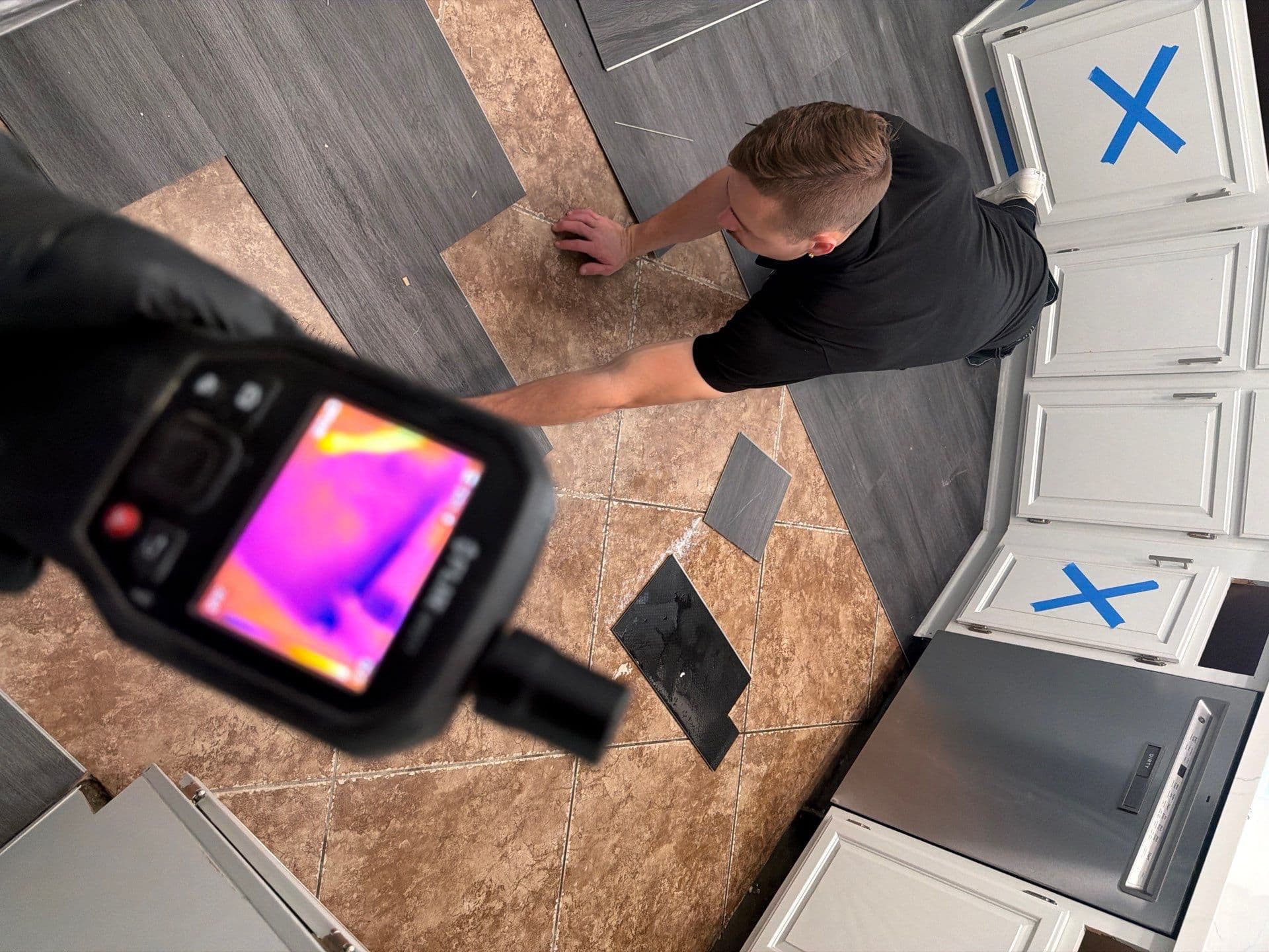 Two Resolve Residential Restoration technicians documenting the scope of a fire loss on a job site