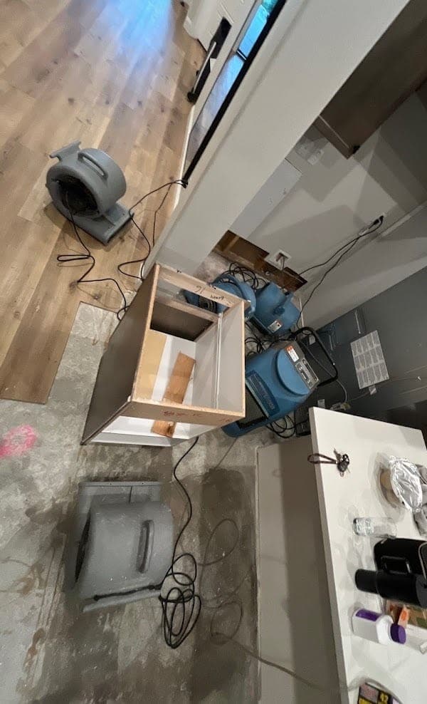 Overhead view of a demolished kitchen with drying equipment on a Resolve Residential Restoration job